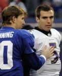New York Giants quarterback Eli Manning and Baltimore Ravens quarterback Joe Flacco talk after the Giants victory in their NFL game in East&nbsp;Rutherford